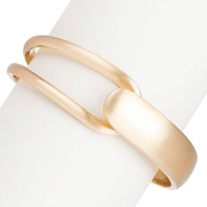 Brushes gold hinged bracelet.
